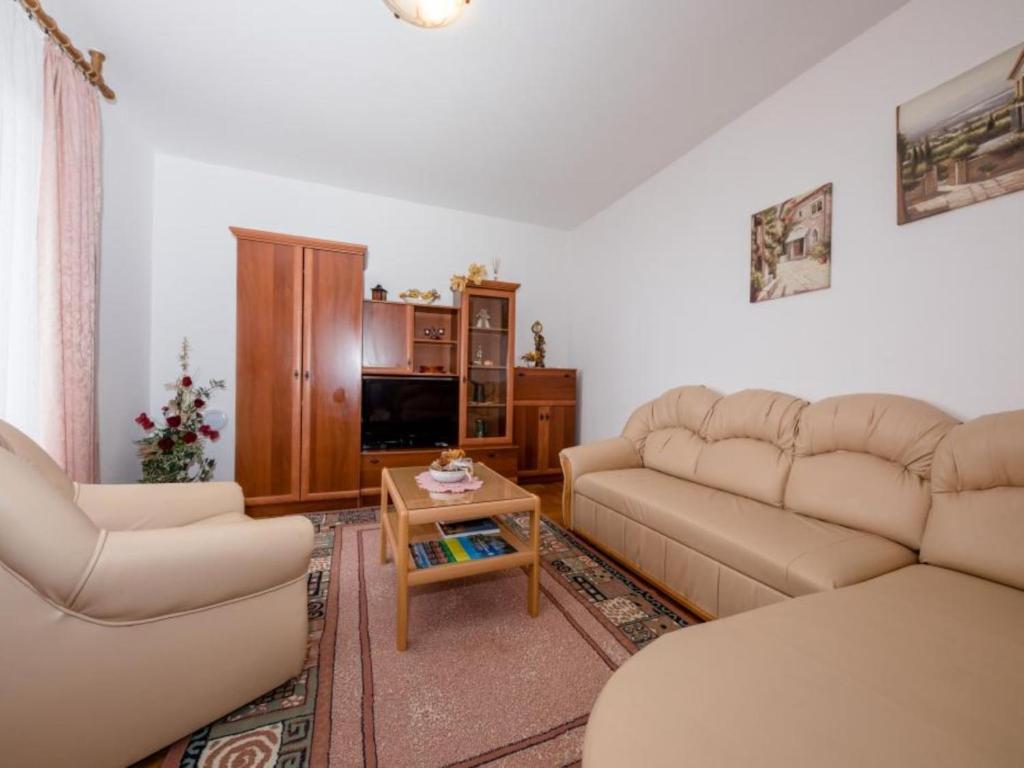 a living room with two couches and a coffee table at Apartments Scerbe Gordana & Miljenko Rab - Two Bedroom Apartment with Terrace 1 in Otok Rab