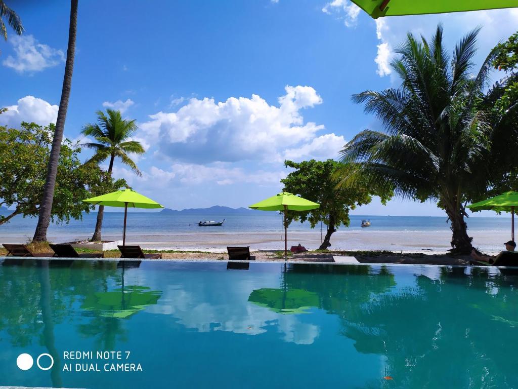 a view of the beach from the pool at the resort at Pawapi Beach Resort in Ko Muk