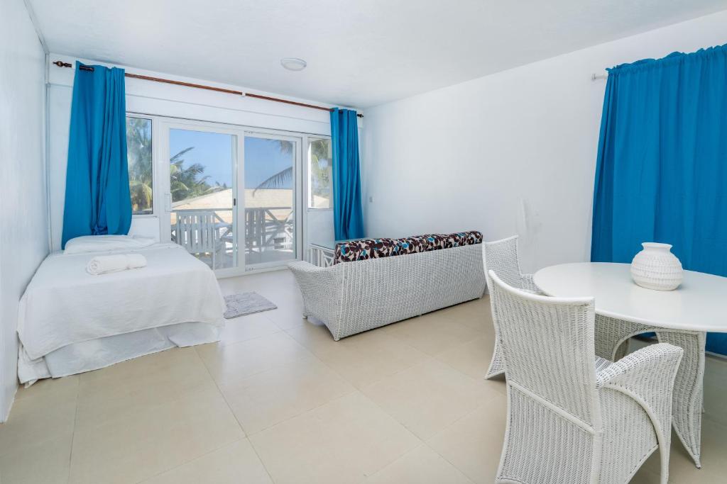 Ένα ή περισσότερα κρεβάτια σε δωμάτιο στο Ocean Spray Apartments