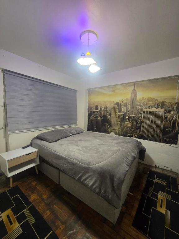 Ένα ή περισσότερα κρεβάτια σε δωμάτιο στο Sunset Forever