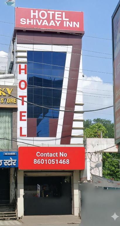 a hotel shimiya inn with a sign on a building at Hotel Shivaay Inn in Kānpur