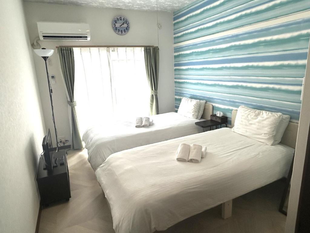 A bed or beds in a room at Rapport Kukomae 206