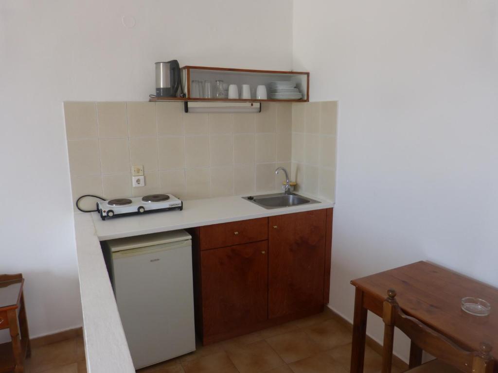 Kuchyň nebo kuchyňský kout v ubytování Miros Hotel Apartments