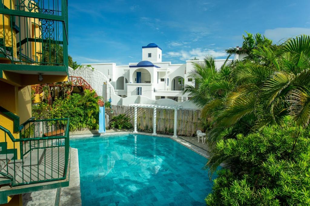 a swimming pool in front of a building at Yahweh's Spring Retreat and Resort in Calamba