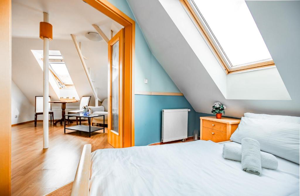 Postel nebo postele na pokoji v ubytování Aparthotel CITY