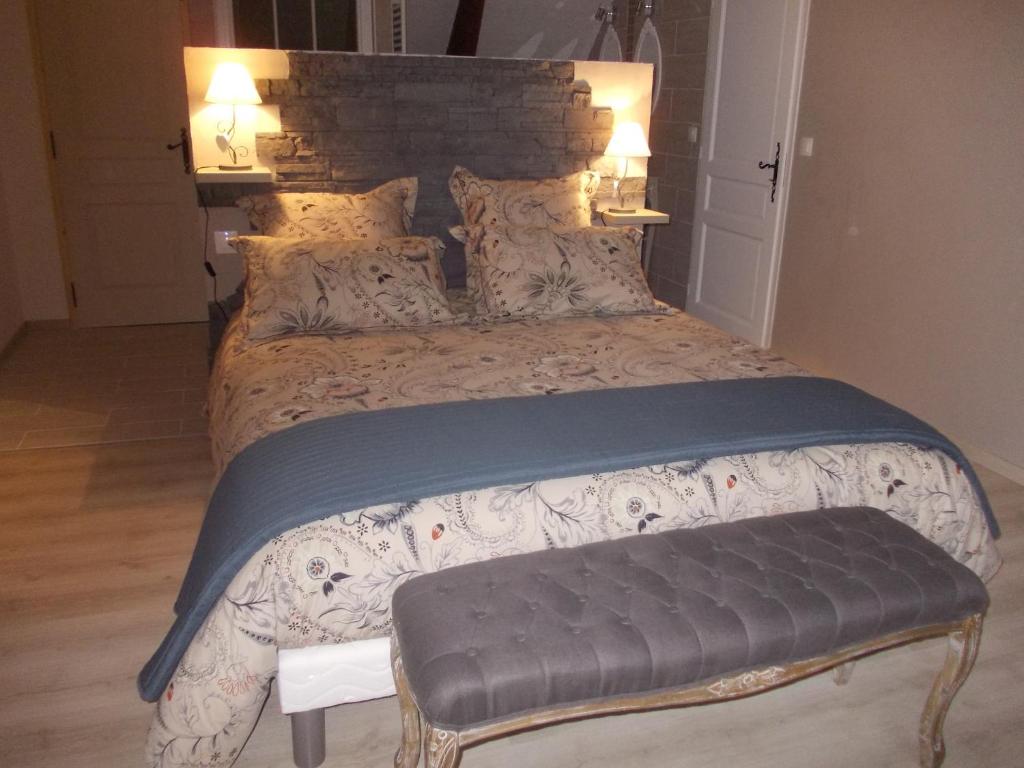 Postel nebo postele na pokoji v ubytování B&B Haras de la Cour Fleury