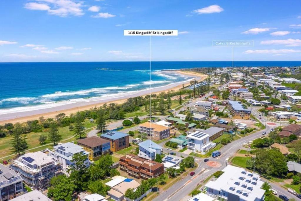 an aerial view of a beach with condos at Wave Whisperer in Kingscliff