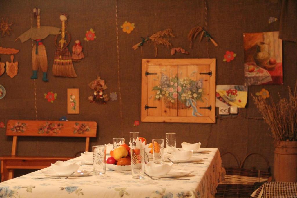 a table with a plate of fruit on it at Шалє Ясна садиба in Yasenitsa Zamkova