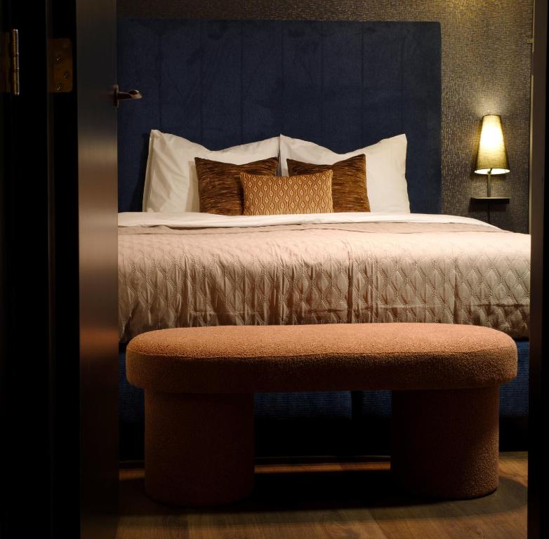 Ένα ή περισσότερα κρεβάτια σε δωμάτιο στο De Nassau - In de winkelstraat