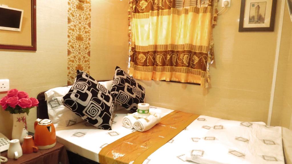 Rúm í herbergi á Paris Guest House (D2, 10/F)