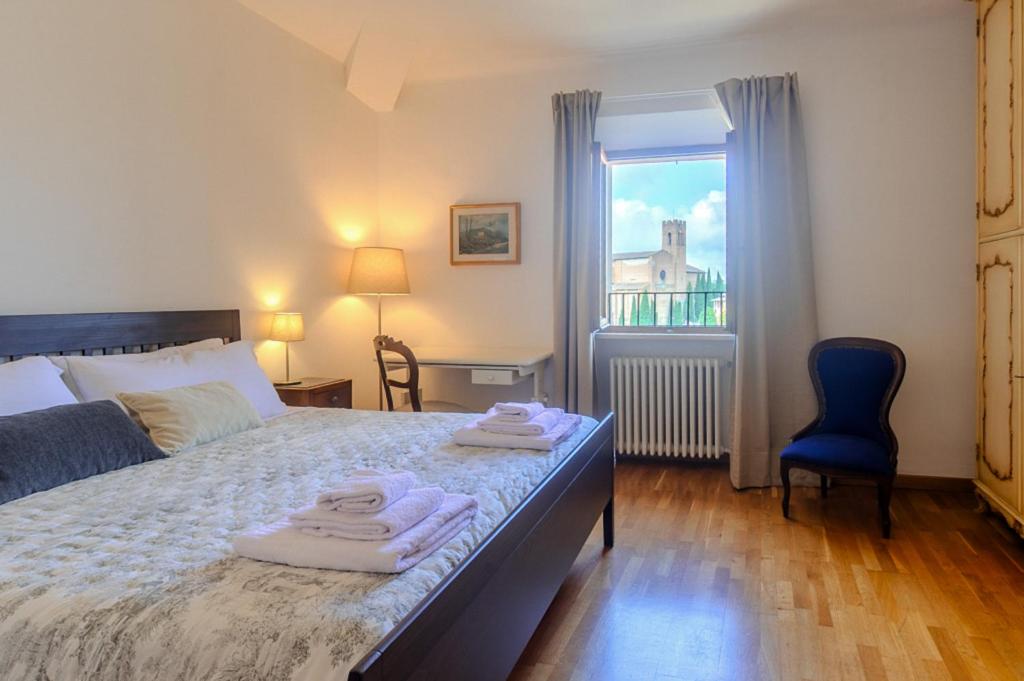 Postel nebo postele na pokoji v ubytování Attico a pochi passi dal Campo