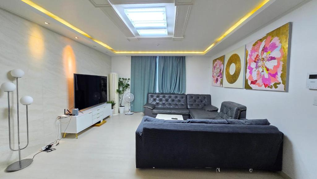 a living room with a couch and a television at Rare House 4 in Incheon