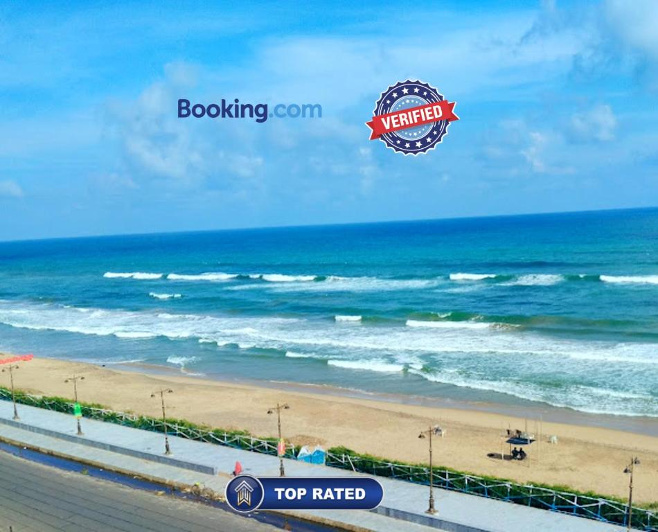 a view of the beach with a hot rated sign at Rooftop Sea View Hotel The Shivalik Premium Deep Ganga Inn Near Jagannath Temple- Lift # Parking Facility # Fully Air Conditioning Premium Rooms-Best Premium Hotel In Puri in Puri