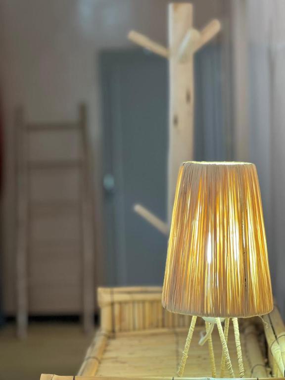 a lamp sitting on a table in a room at Berber RIAD with big terrace in Aourir