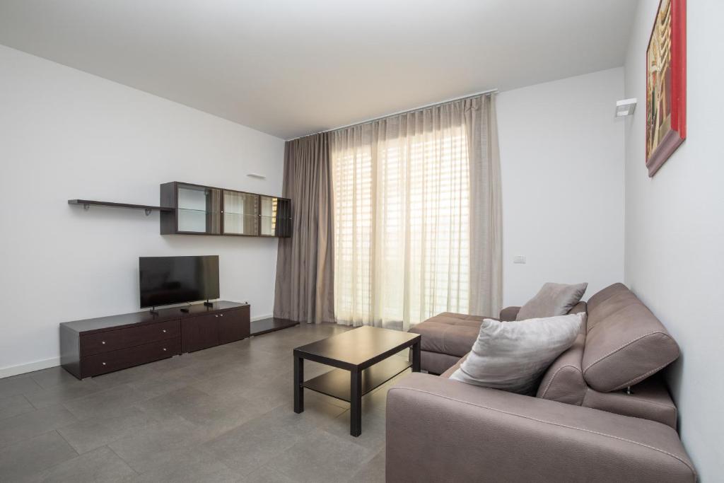 Μια τηλεόραση ή/και κέντρο ψυχαγωγίας στο Appartamenti Torre del Capitano