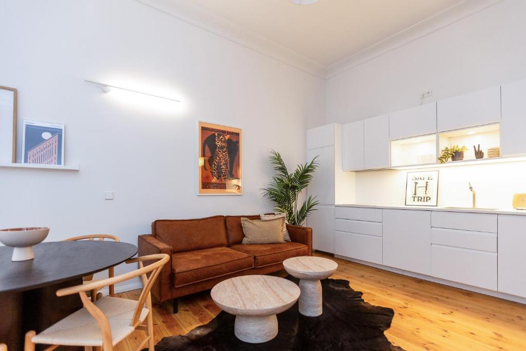 a living room with a couch and a table at Berlin & Friends in Berlin