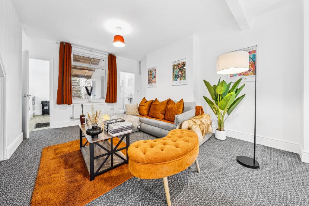 a living room with a couch and a table at Clover House Stunning Cosy Cottage 3BR By AltoLuxo Short Lets & Serviced Accommodation With Free WiFi & Parking in Ebbw Vale