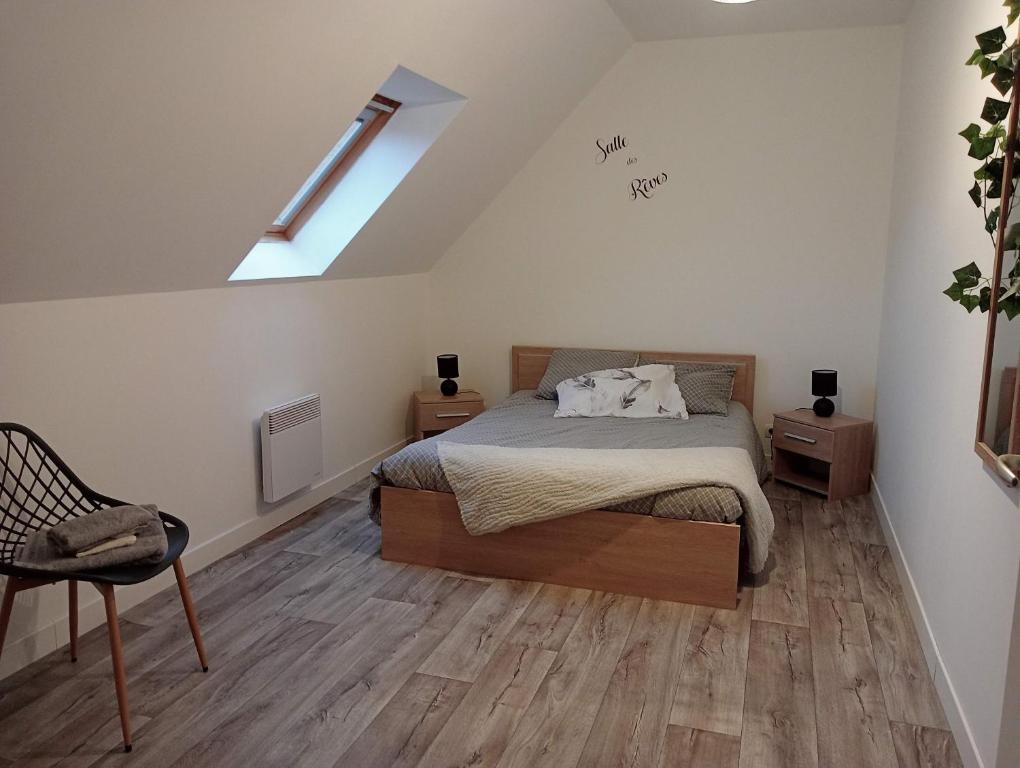 a bedroom with a bed and a skylight at La Maison Enzo in Arrest