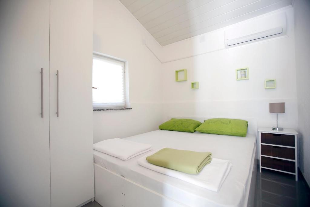 Posteľ alebo postele v izbe v ubytovaní Apartments Pavlic
