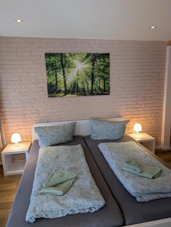 a bedroom with a large bed with two pillows at Stadtnah an der Förde 5501 in Flensburg