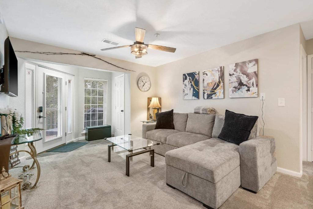 a living room with a couch and a ceiling fan at Restful Retreat - 2BDR for 6 in Kimberling City