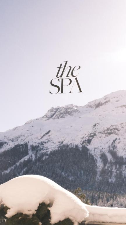 a snow covered mountain with the spy written on it at Hotel GRACE LA MARGNA ST MORITZ in St. Moritz