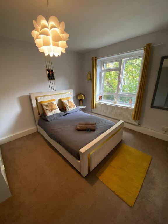 Ένα ή περισσότερα κρεβάτια σε δωμάτιο στο 18K HOME FROM HOME