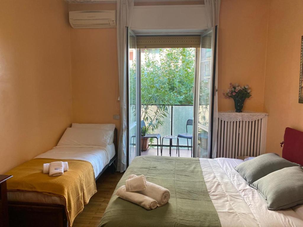 Ένα ή περισσότερα κρεβάτια σε δωμάτιο στο B&K Hotels