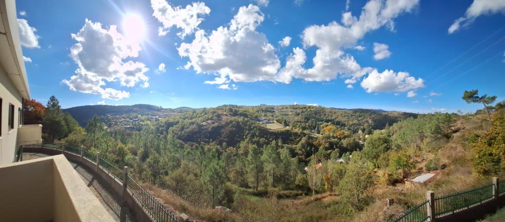 a view of the mountains from a balcony of a house at O cantinho do Avô Alberto 