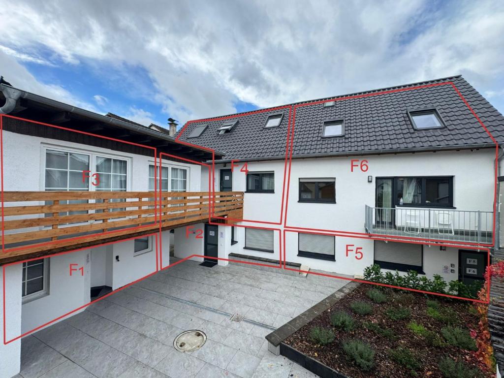 anterior view of a building with a large patio at F 2 - 2 Zimmer Wohnung in Offenbach