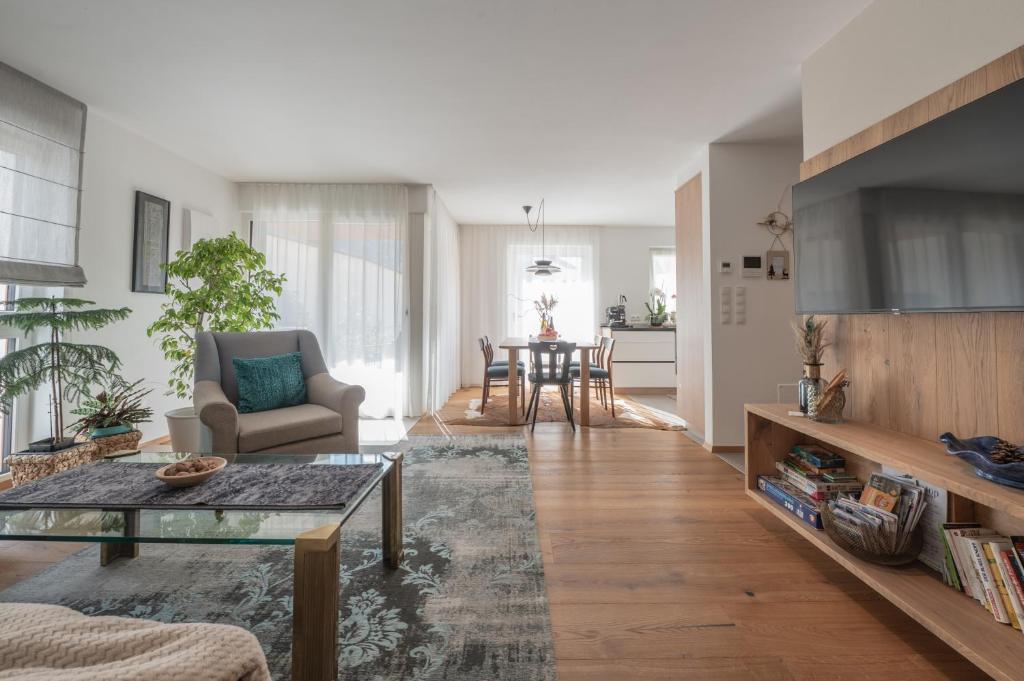 a living room with a couch and a table at BioTop Appartement Kronplatz in Perca