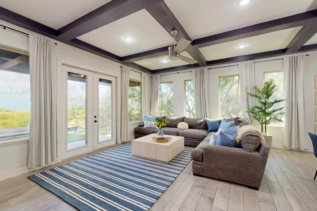 a living room with a couch and a table at Casa Sol Y Mar in Port Isabel