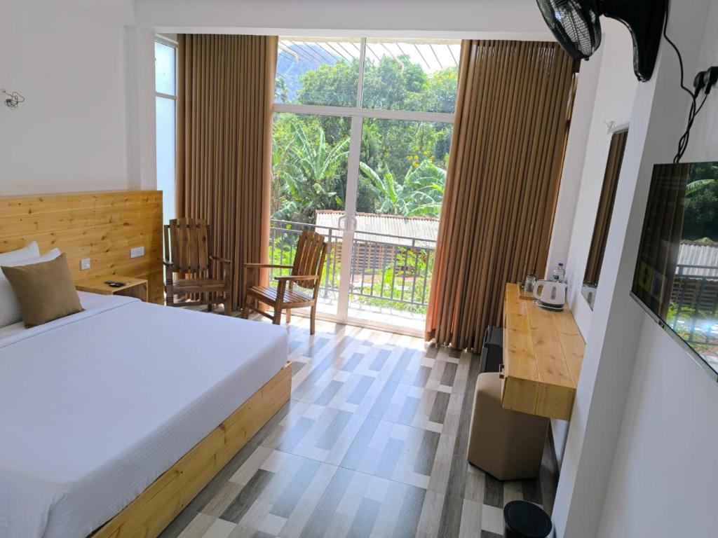 Ένα ή περισσότερα κρεβάτια σε δωμάτιο στο Legacy Inn Ella