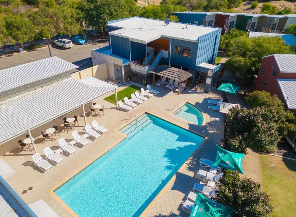 an overhead view of a pool with chairs and a building at Beach Shack 6 in Preston Beach