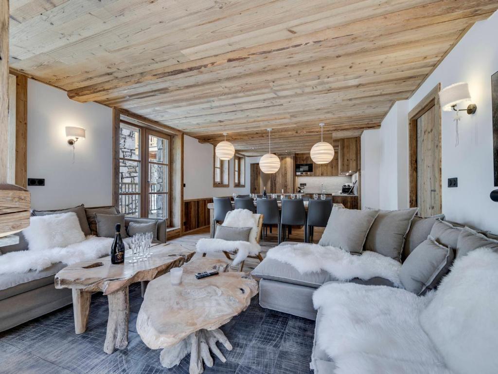 a living room with a couch and a table at Appartement Familial Confort à Val-d'Isère, Proche Pistes, 10 Pers., Cheminée, Services Inclus - FR-1-567-106 in Val dʼIsère
