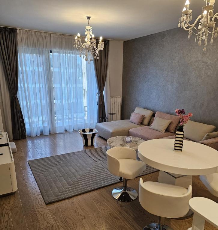 a living room with a couch and a table at BW Maša in Belgrade
