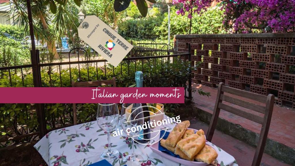 a table with a plate of pastries on it at Il Giardino di Ada Ground Floor Studio with AC and Patio in Monterosso al Mare