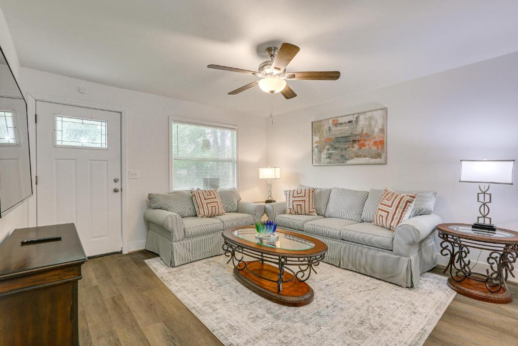a living room with a couch and a table at Pet-Friendly Duplex with Large Yard in Fort Myers! in Fort Myers