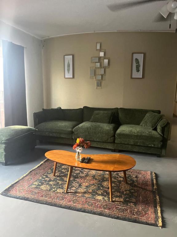 a living room with a couch and a coffee table at The Jefferson Suite in Eagle Pass