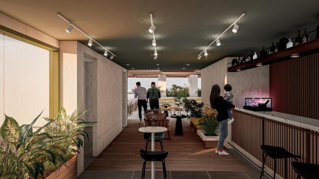 a group of people standing in a restaurant at LAS CONDES Hotel in Tacna
