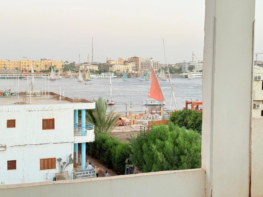 a view of a harbor with boats in the water at Nile View House in Luxor