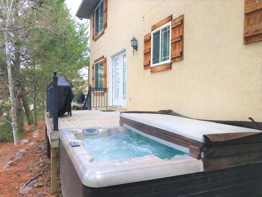 a hot tub in the backyard of a house at Union Duplex in Salt Lake with Hot Tub and Park in Midvale