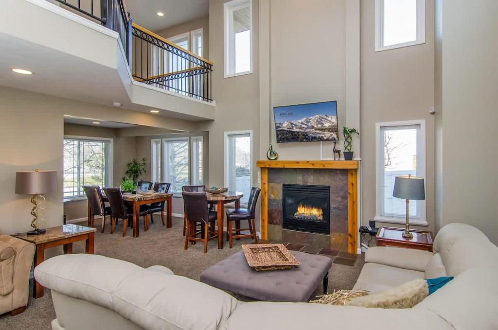 a living room with a couch and a fireplace at Union Cove in Salt Lake with Secluded Privacy in Midvale