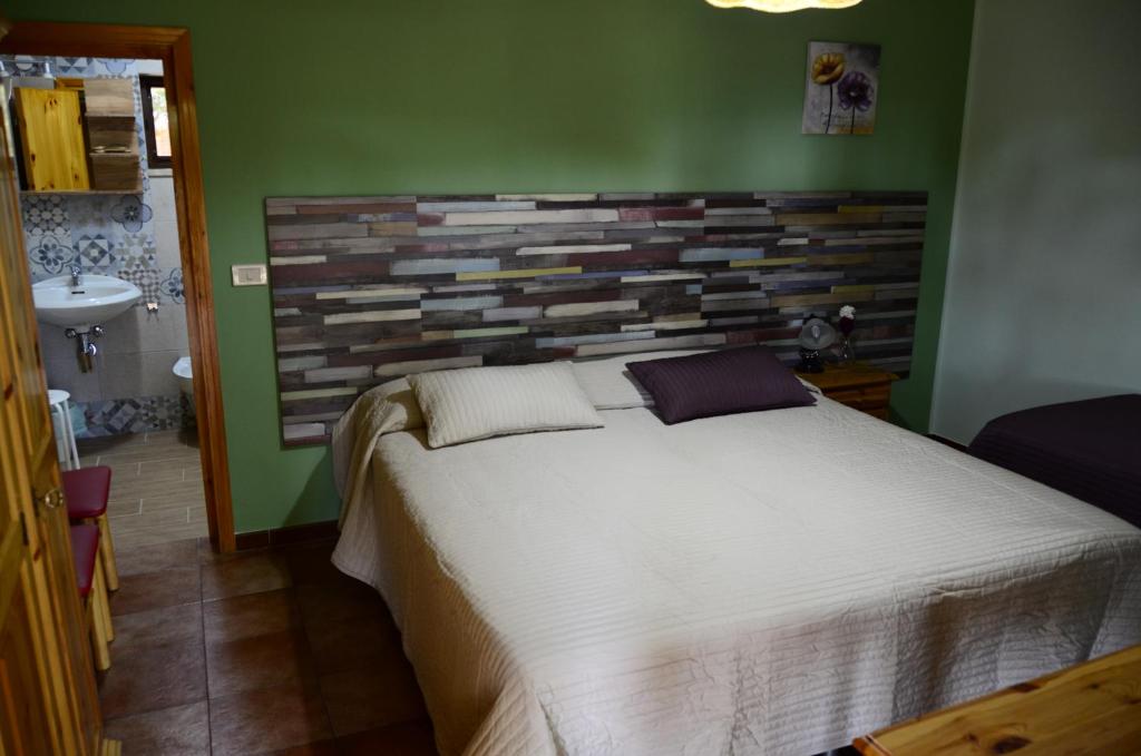 Łóżko lub łóżka w pokoju w obiekcie Agriturismo Valle Verde