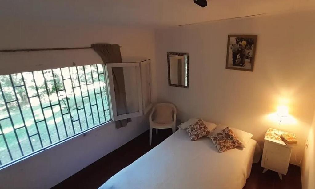 En eller flere senge i et værelse på La Gloriosa eco house