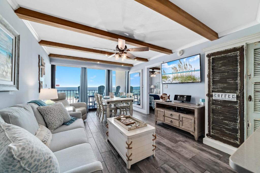 a living room with a couch and a table at Island Winds East Condo 402 in Gulf Shores