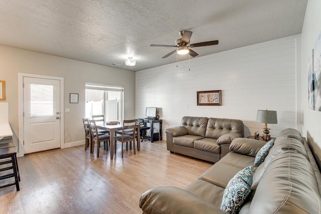 a living room with a couch and a table at 25 Mi to Cedar Breaks Unit with Furnished Patio! in Enoch
