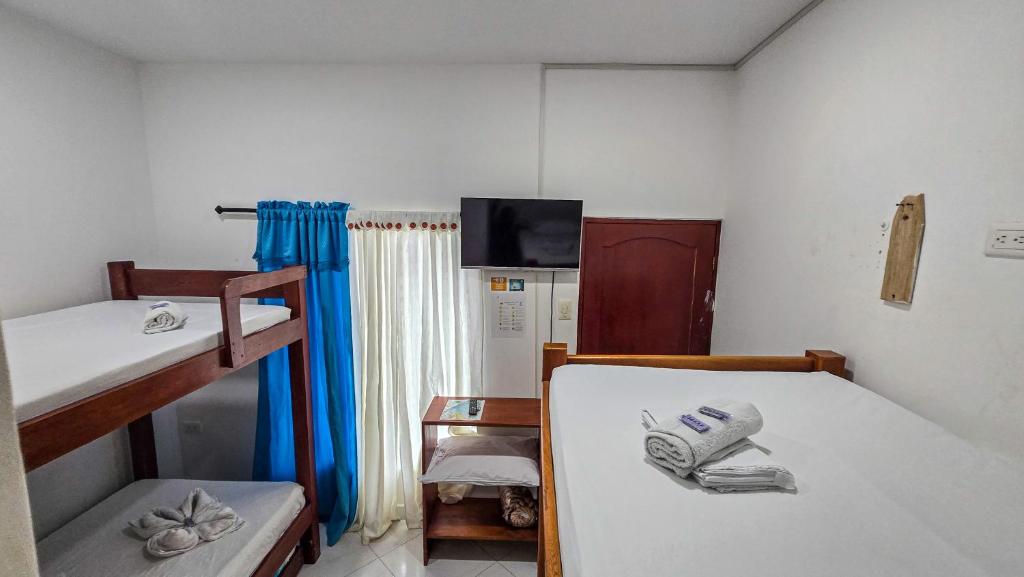 Ένα ή περισσότερα κρεβάτια σε δωμάτιο στο Hotel Sueños Libres Necoclí