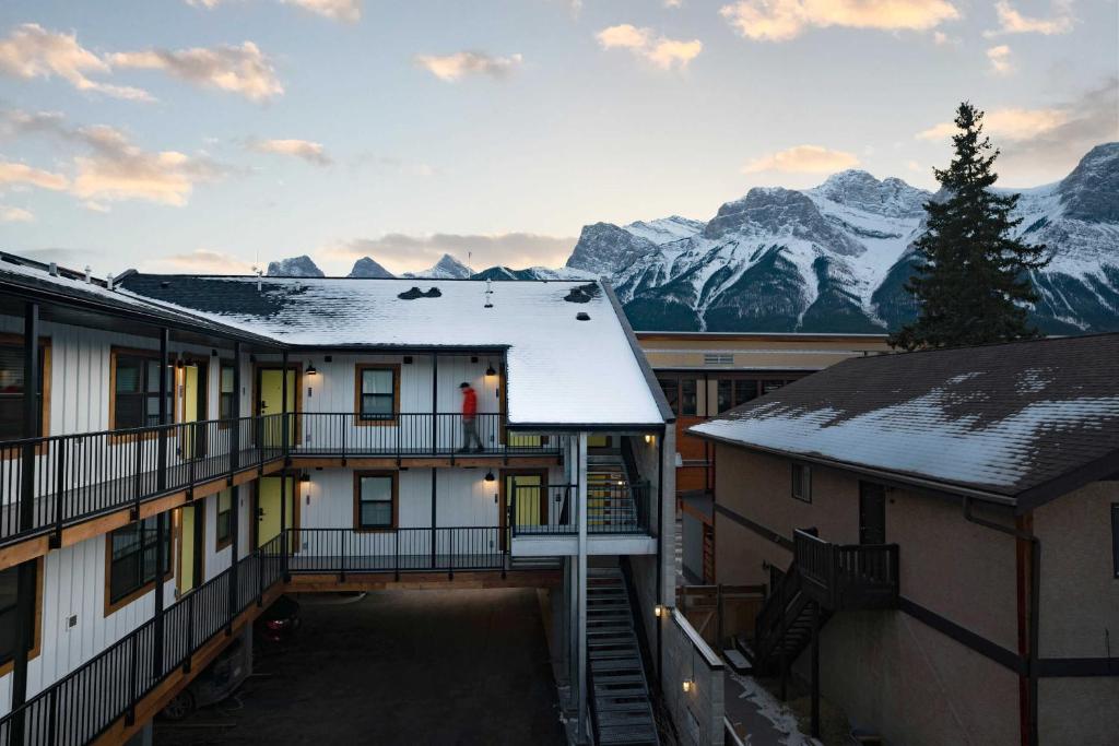 a view of the mountains from the balcony of a hotel at Basecamp Suites Canmore in Canmore
