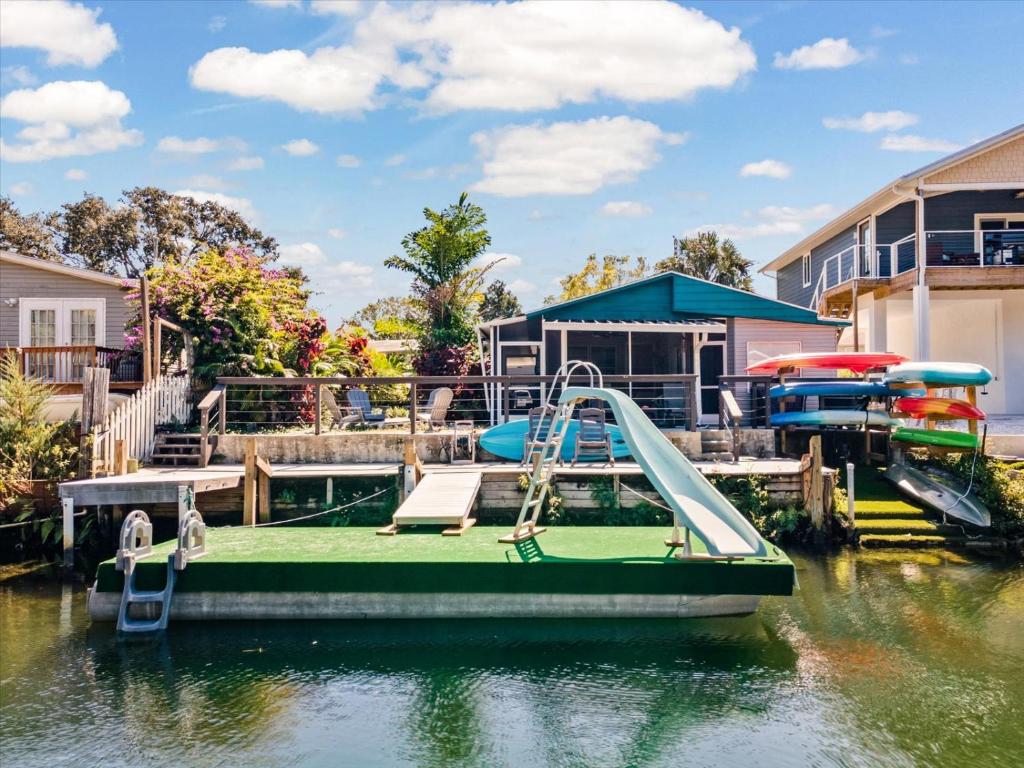 a slide on a boat in a body of water at The Hideaway at Weeki Wachee in Weeki Wachee